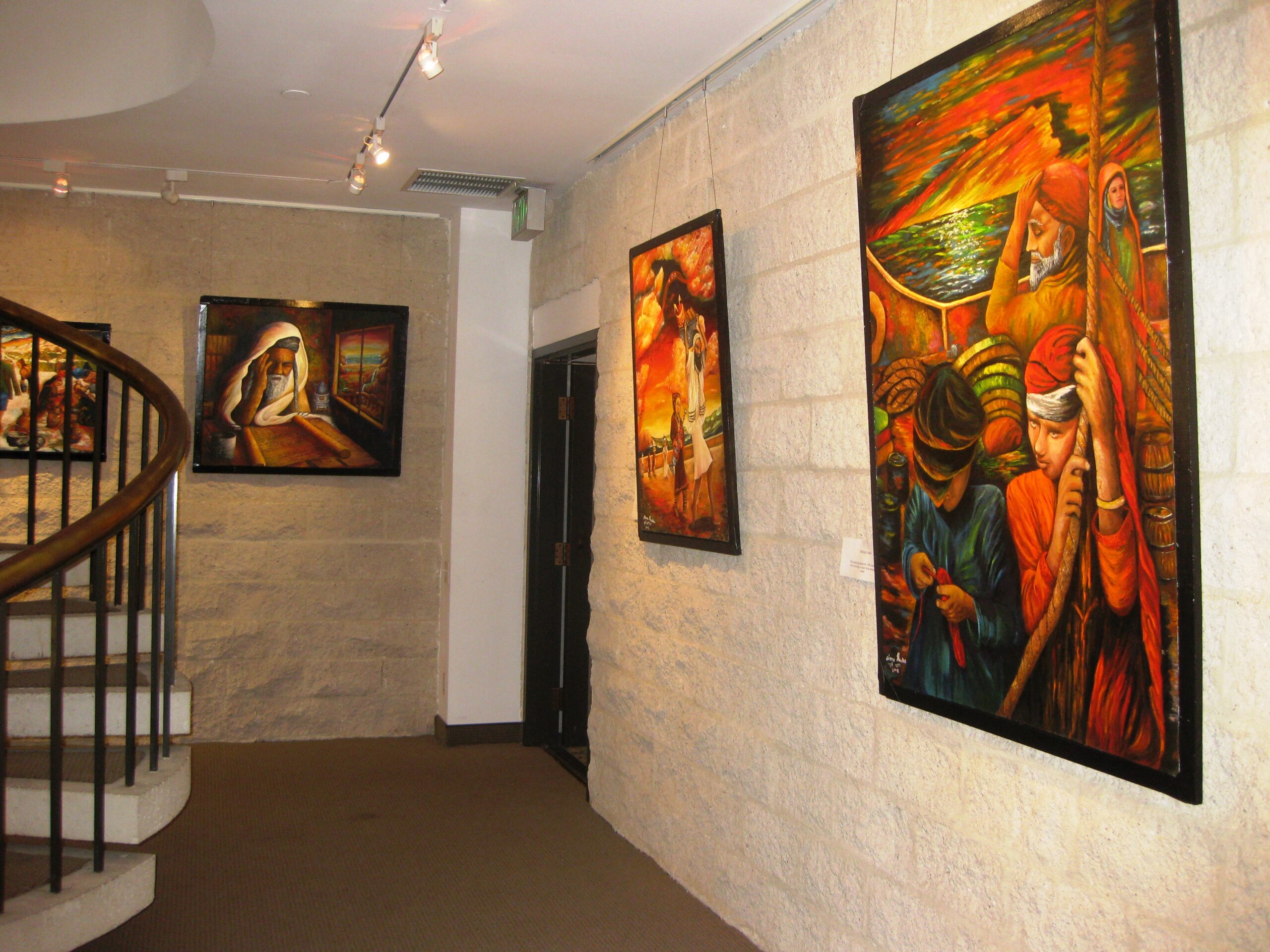 Original paintings displayed on gallery walls during Siona Thacker's solo exhibition in Beverly Hills, California.