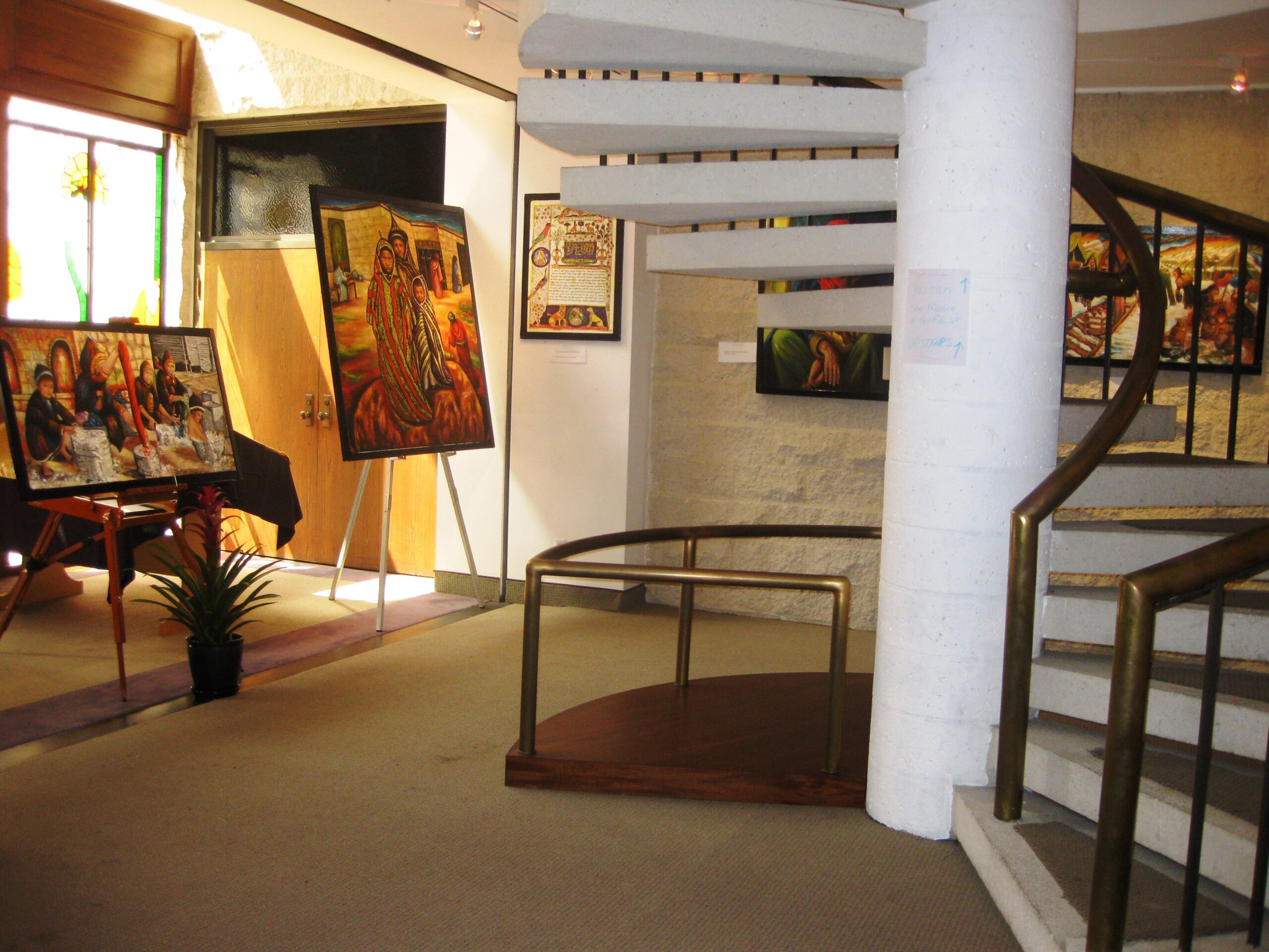 Gallery interior displaying original paintings during Siona Thacker's solo exhibition in Beverly Hills, California.